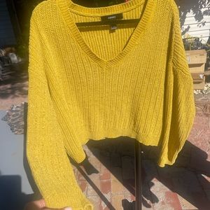 Forever 21 sweater. A little oversized. Bellybutton length. Used a couple times.